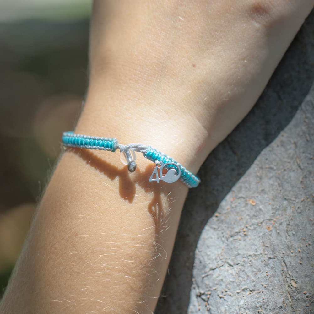 4ocean Dolphin Braided Bracelet On a Wrist