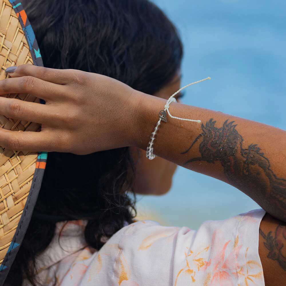 4ocean Polar Bear Beaded Bracelet on a woman's wrist