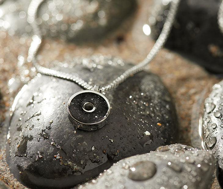 This 18” box chain necklace is made from recycled stainless steel. Designed to represent the tires we’re recovering from the Osborne Reef, the tire-shaped pendant is filled with verified 100% crumb rubber from tires that our crews recovered directly from the Osborne Reef.