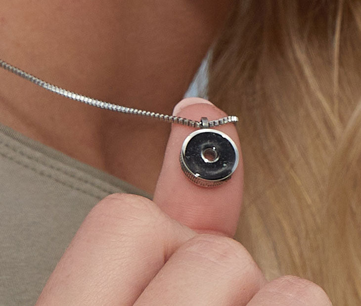 This 18” box chain necklace is made from recycled stainless steel. Designed to represent the tires we’re recovering from the Osborne Reef, the tire-shaped pendant is filled with verified 100% crumb rubber from tires that our crews recovered directly from the Osborne Reef.