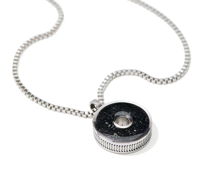 This 18” box chain necklace is made from recycled stainless steel. Designed to represent the tires we’re recovering from the Osborne Reef, the tire-shaped pendant is filled with verified 100% crumb rubber from tires that our crews recovered directly from the Osborne Reef.
