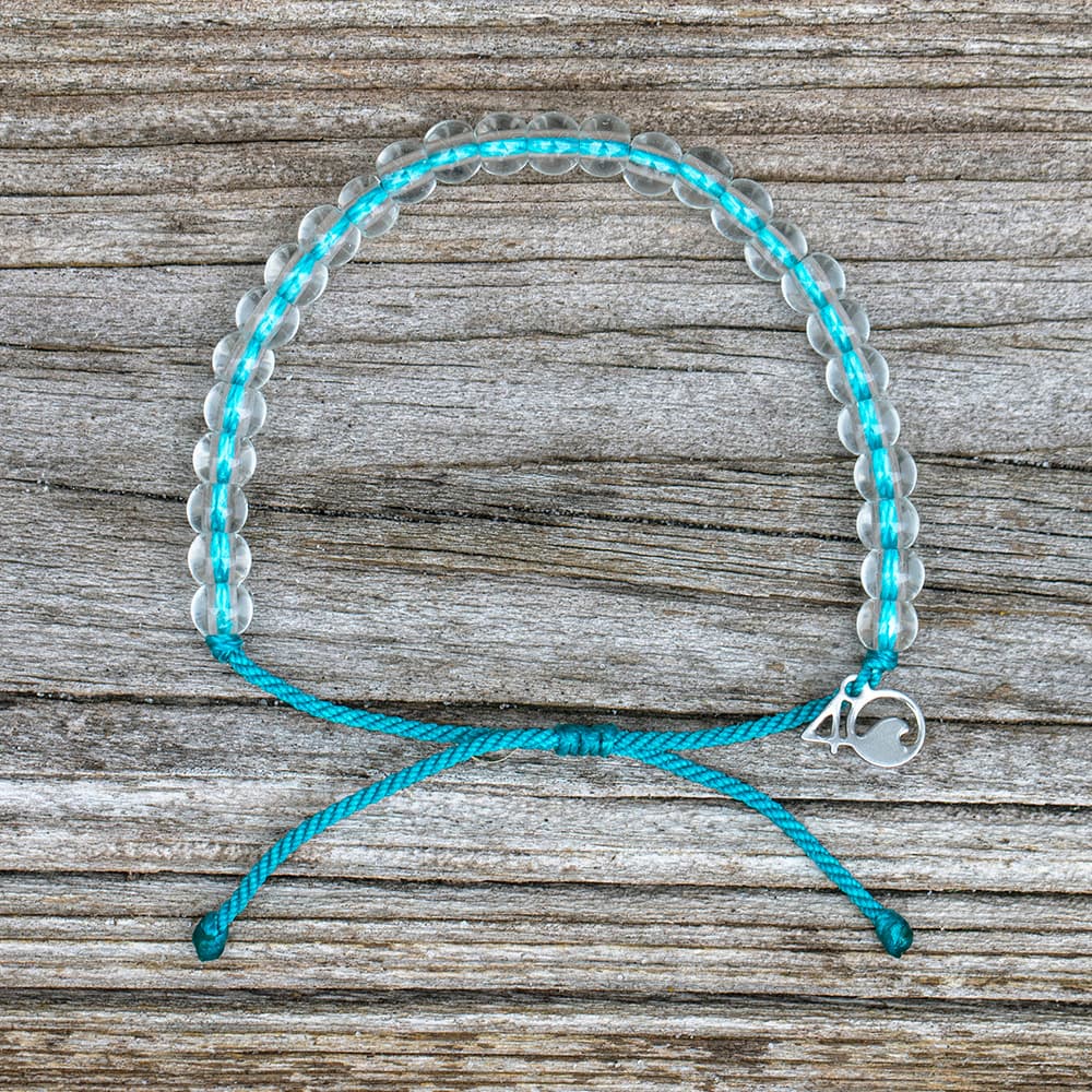 4ocean White-Sided Dolphin Beaded Bracelet on a wooden plank