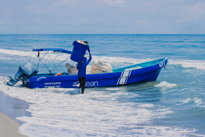 4ocean worker cleaning plastic and trash pollution from the ocean.