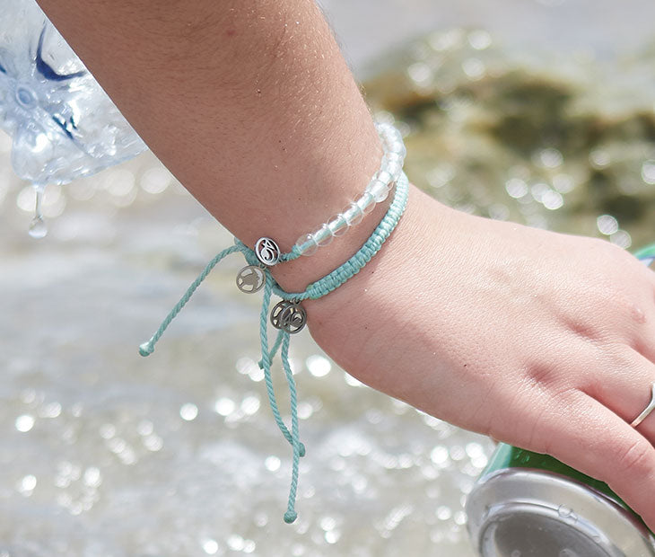 Olive Ridley Sea Turtle Beaded and Braided Bracelets on female model