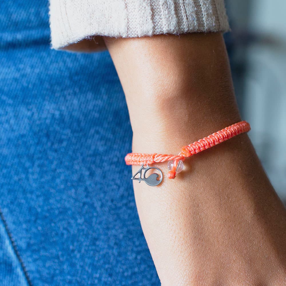 Closeup of a Person Wearing the 4ocean Albatross Braided Bracelet
