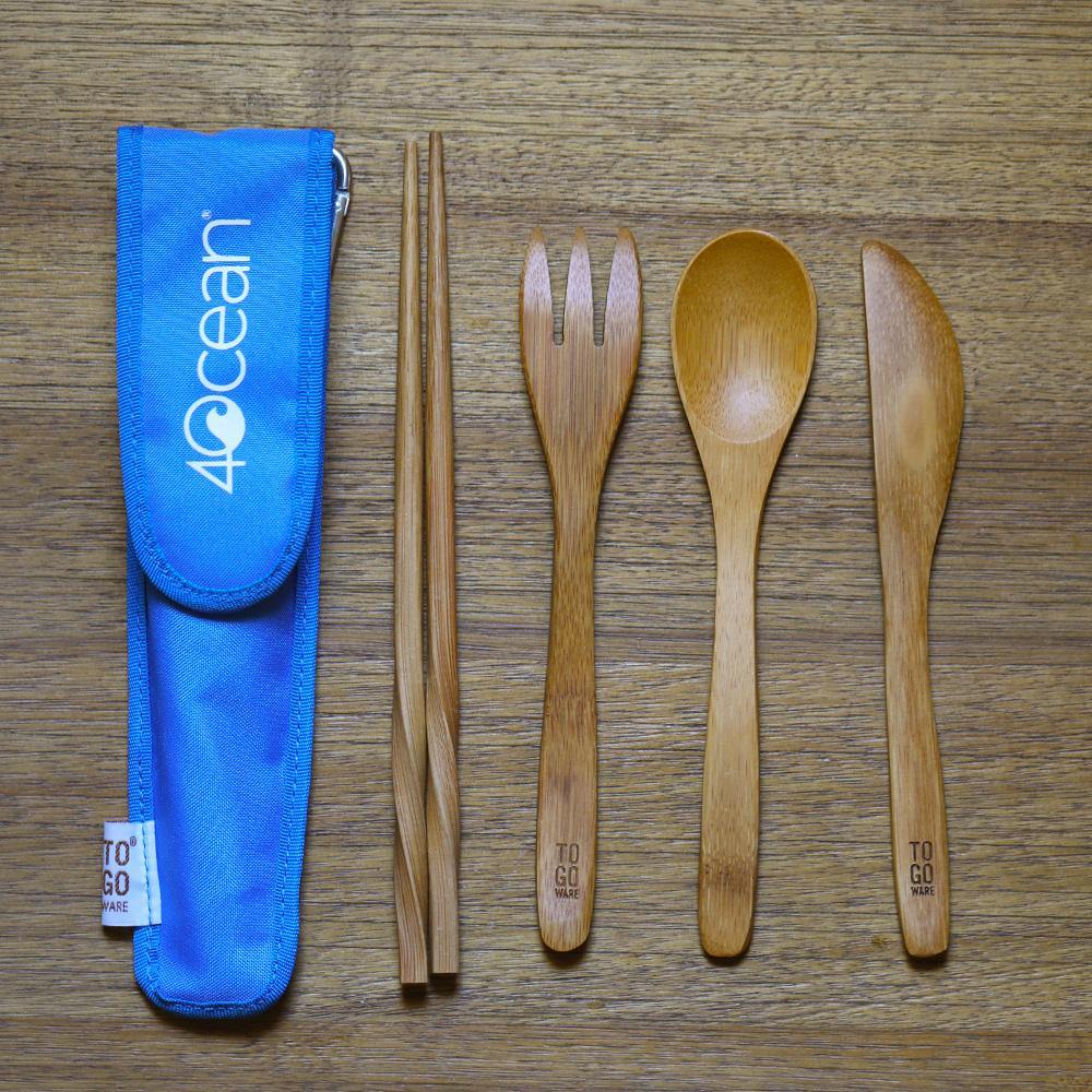 4ocean To-Go Wear Reusable Bamboo Eating Utensils clipped on a table