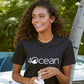 4ocean logo unisex men's and women's t-shirt on a woman - black