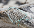 Olive Ridley Sea Turtle Beaded Bracelet on drift wood.