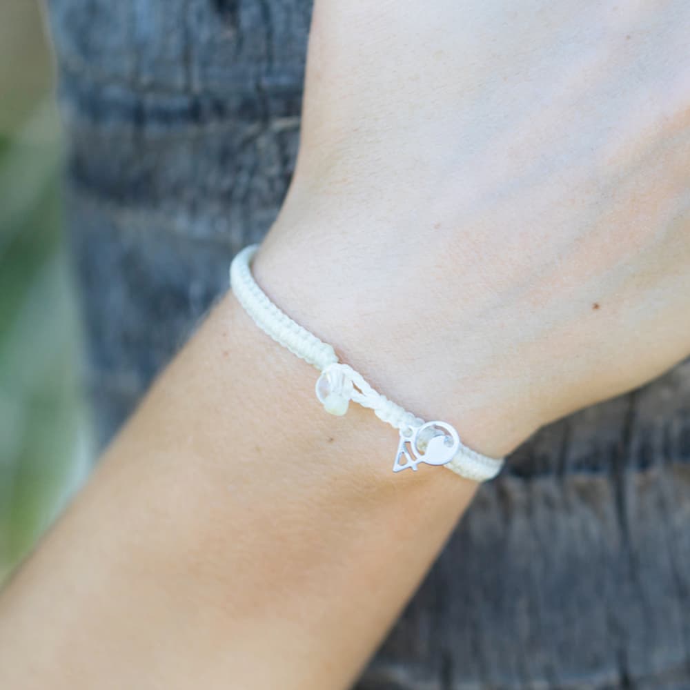 4ocean Polar Bear Braided Bracelet on a woman's wrist