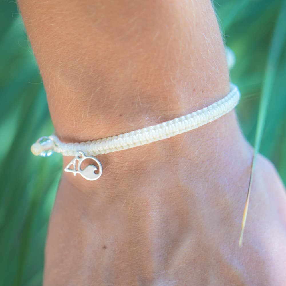 4ocean Polar Bear Braided Bracelet on a man's wrist
