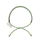 4ocean Earth Day Braided Bracelet 2022 - green. On white background.