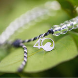 4ocean Great White Shark Beaded Bracelet close-up on a leaf