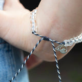 4ocean Great White Shark Beaded Bracelet on a woman's wrist