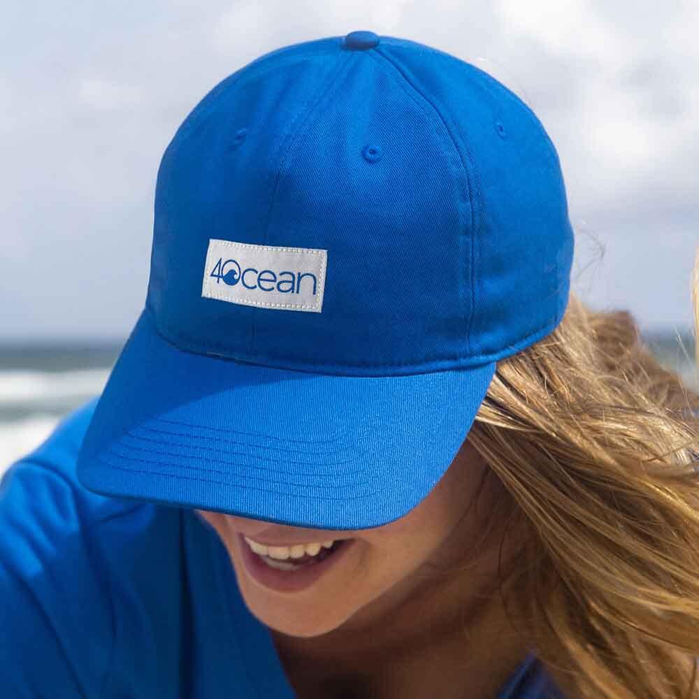 Woman wearing 4ocean low profile patch logo hat