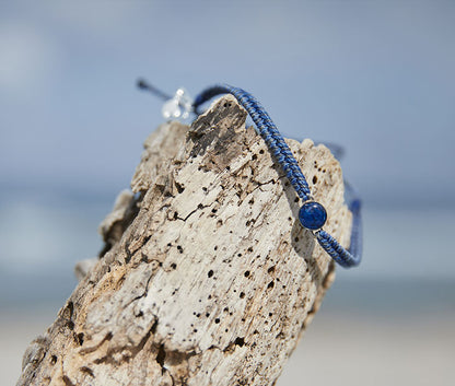 4ocean Ocean Drop Bracelet. Black and blue braided cord with stainless and blue bezel 