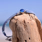 4ocean Blue Ocean Drop bracelet. Blue and white braided cord with stainless and blue bezel.