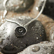 This 18” box chain necklace is made from recycled stainless steel. Designed to represent the tires we’re recovering from the Osborne Reef, the tire-shaped pendant is filled with verified 100% crumb rubber from tires that our crews recovered directly from the Osborne Reef. 