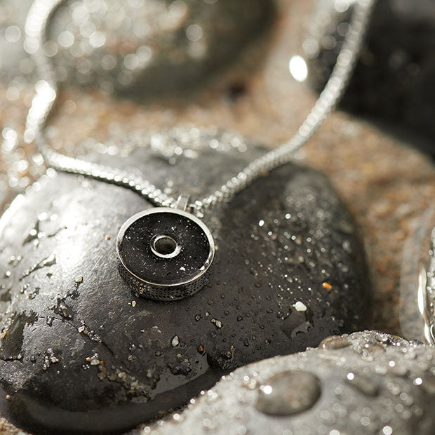 This 18” box chain necklace is made from recycled stainless steel. Designed to represent the tires we’re recovering from the Osborne Reef, the tire-shaped pendant is filled with verified 100% crumb rubber from tires that our crews recovered directly from the Osborne Reef. 