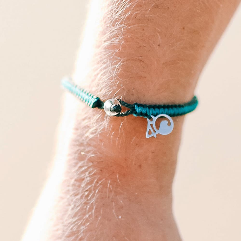 4ocean Sea Otter Braided Bracelet on a Wrist Closeup