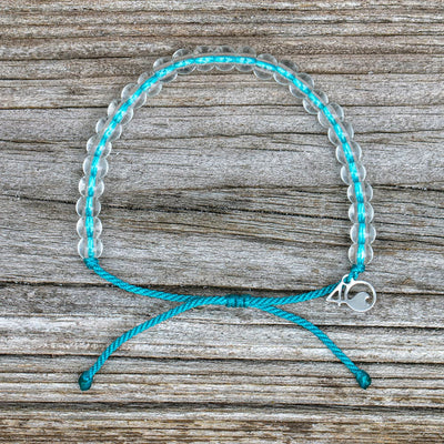 4ocean White-Sided Dolphin Beaded Bracelet on a wooden plank
